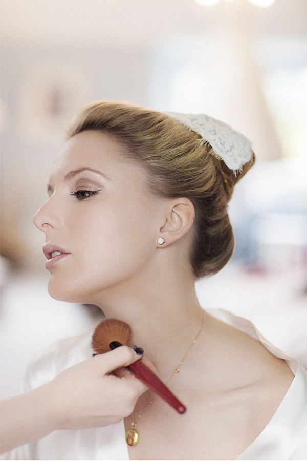 bride having her makup done with italian hair piece