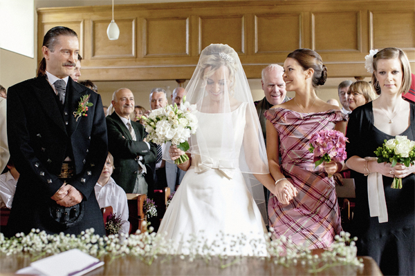 bride walking down the aisle in scottish church