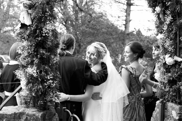 bride looking at photographer during wedding