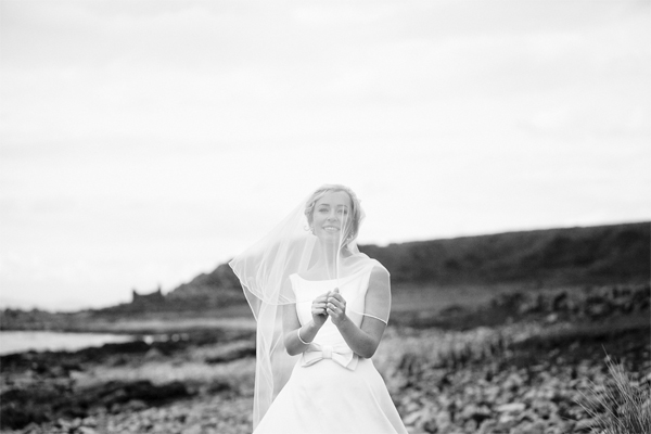 bride on a beach during wedding photo session