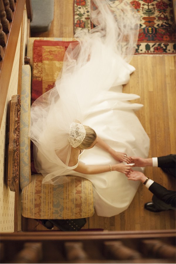 wedding photographer glasgow bride and groom holding hands during wedding reception at home in glasgow view from top