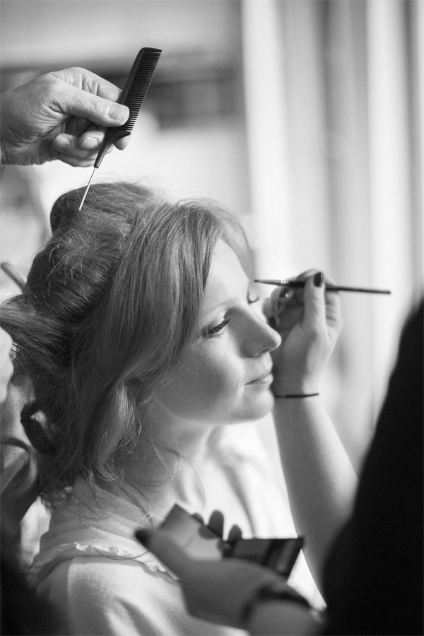bride having make-up done preparatins for winter wedding at cameron house loch lomond scotland