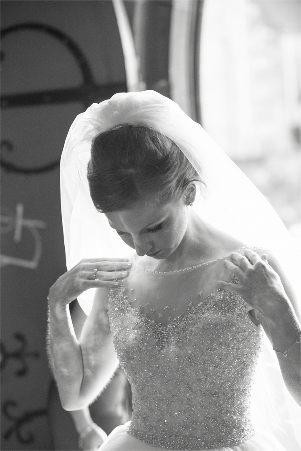 bride fixing her dress