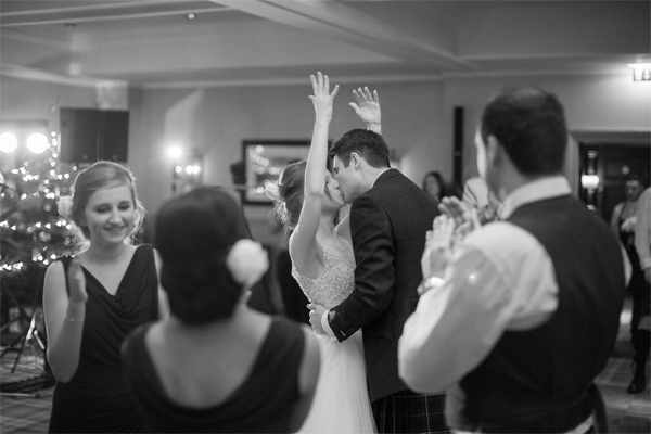 bride and groom kisses during dancing