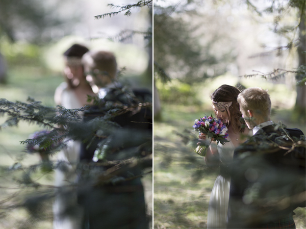 view through trees at bride and groom