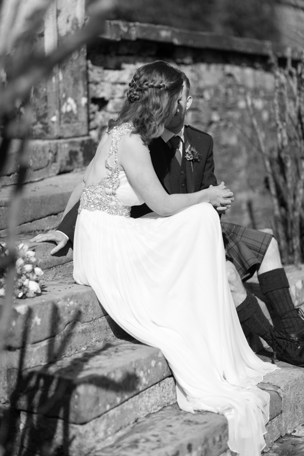 newlyweds holding hands at Blairquhan Castle gardens