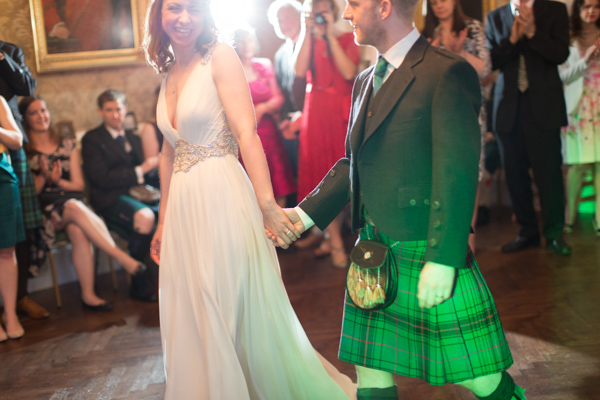 bride and groom walking into their first dance at Blairquhan Castle