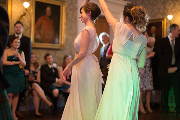 bridesmates dancing together on a wedding