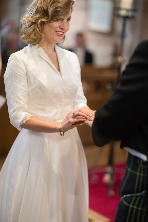 bride and groom exchanging wedding rings edinburgh scotland
