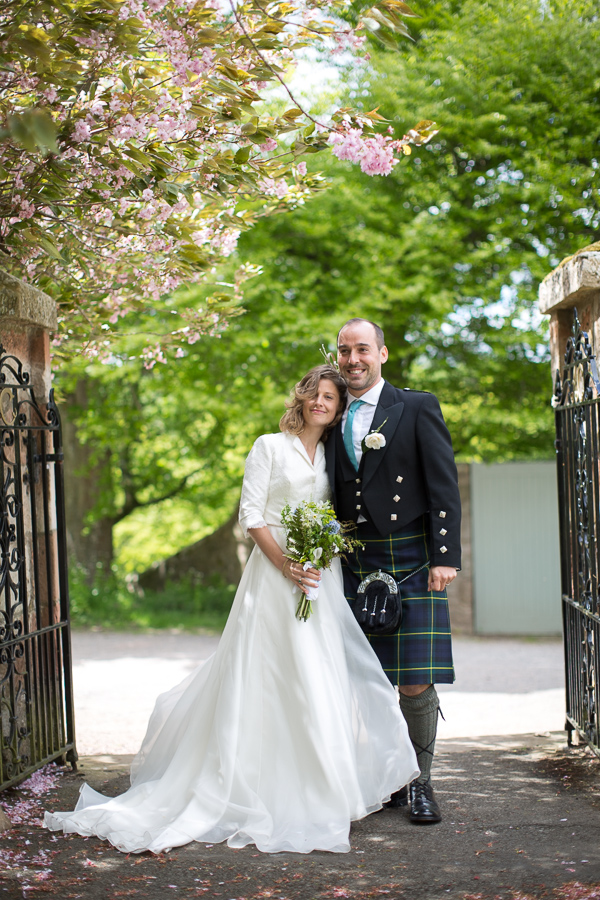 bride and groom embraced at church