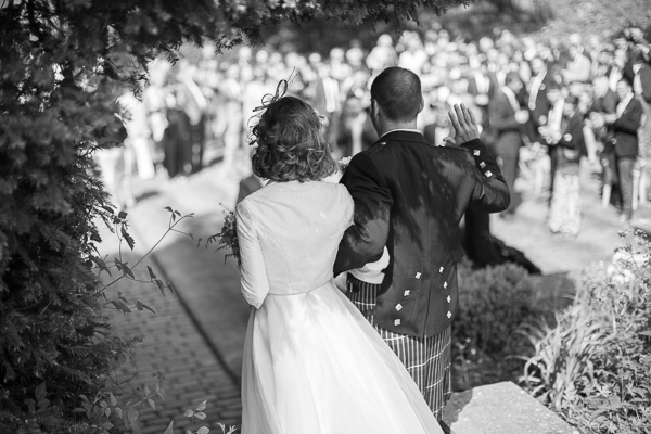 newlyweds arriving at the reception