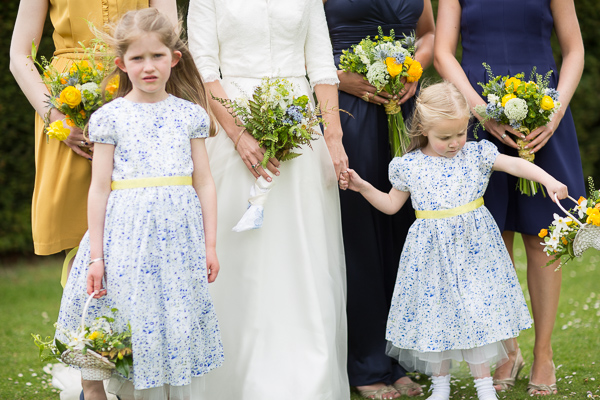 bride with briesmates and flower grils