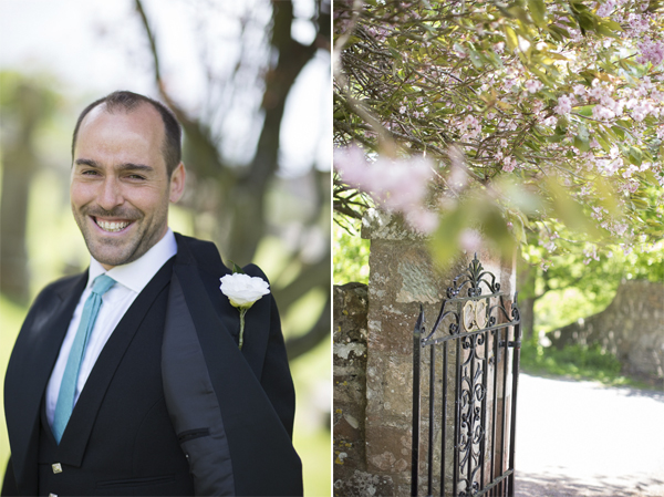 groom smiling and open gate to the church were ceremony beeing held