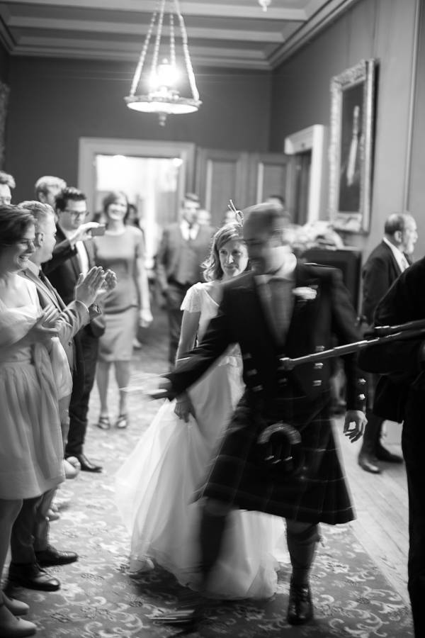 newlyweds walking in for cutting of the cake at oxenford castle