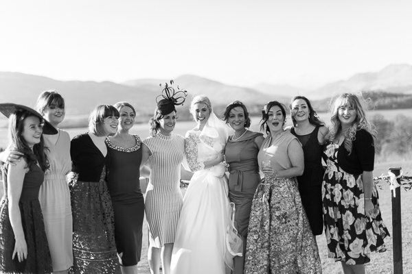 bride with her girlfriends laughing