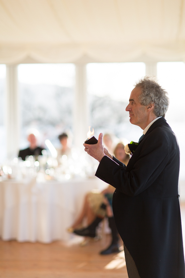 father doing a magic trick during his speech