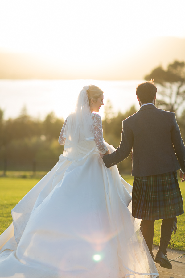 bride laughing while walking away