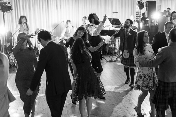 rock band playing and guests dancing