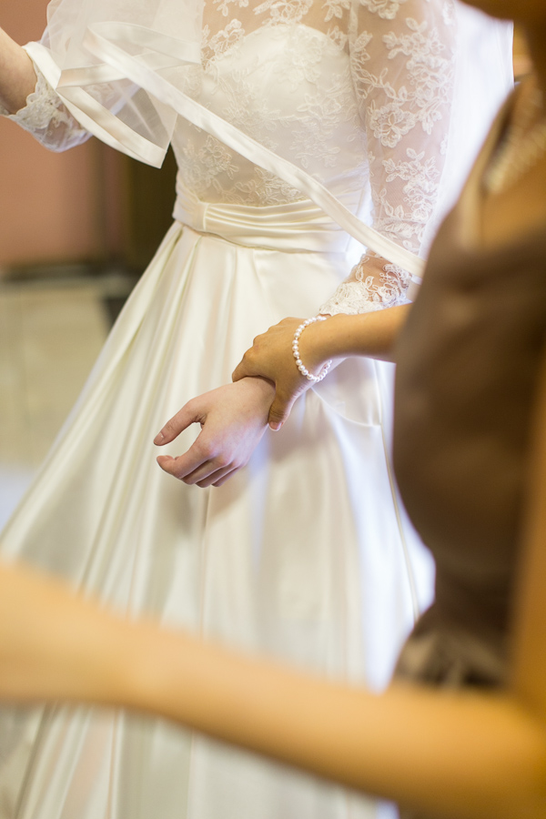 bridesmate holding bride