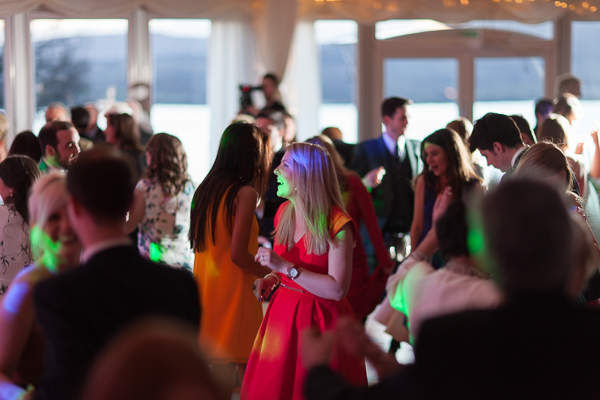guests dancing with disco lights
