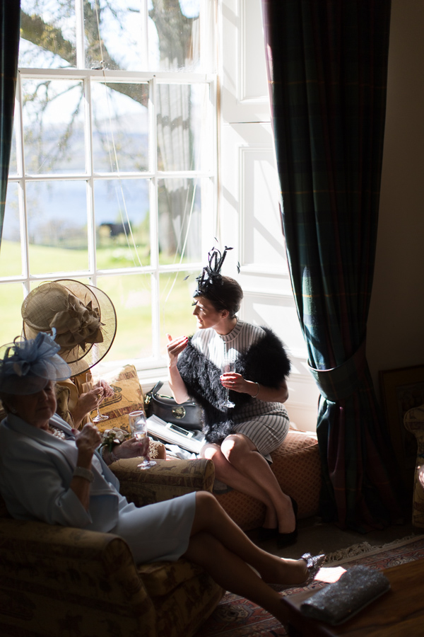 guests cahtting at the castle scotland wedding photos