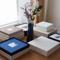 wedding albums photos on a table with flowers from glasgow scotland photographer
