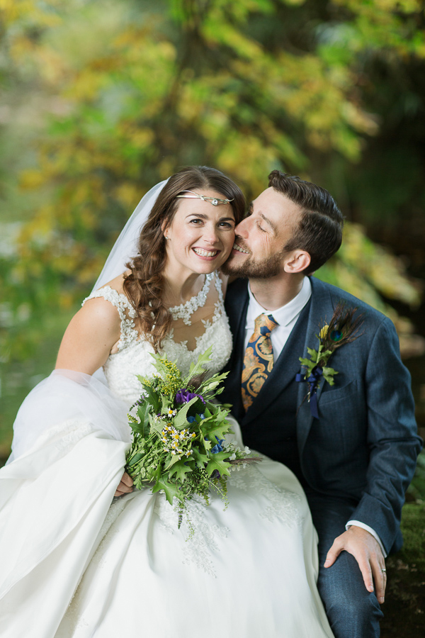 wedding photographers bride and groom happy kissing