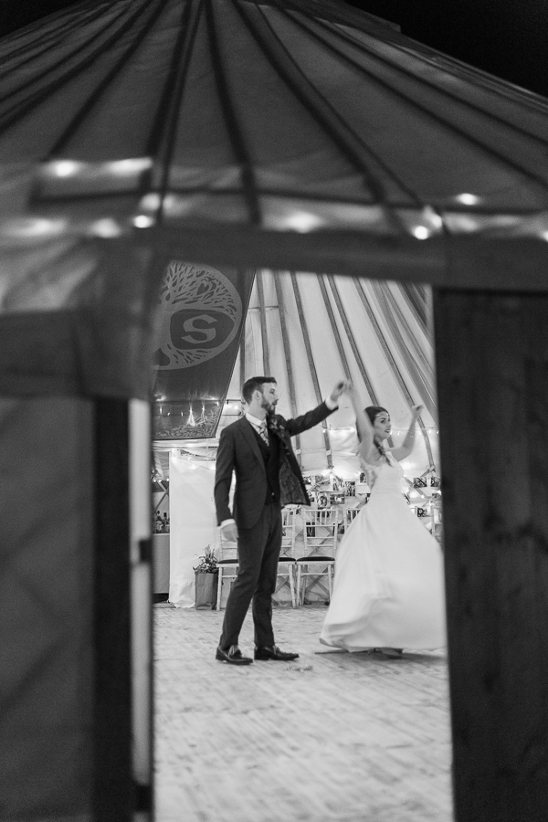 bride and groom practising before the furst dance at tipi tent