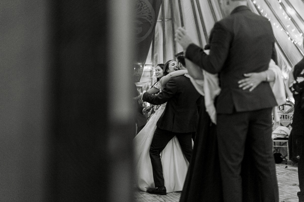 bride and groom embraced during dance