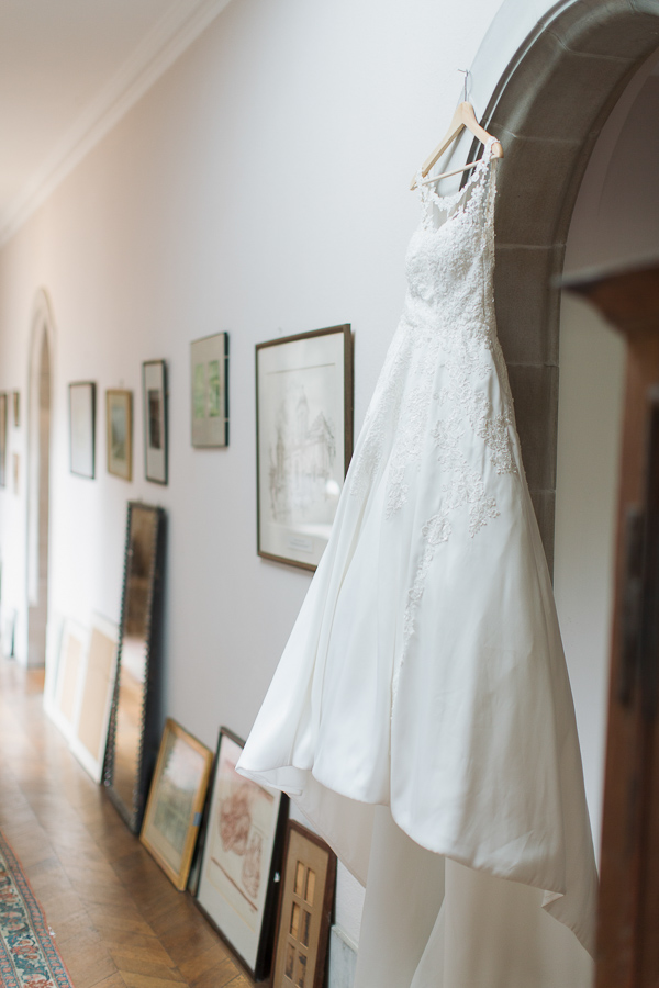 wedding dress hanging in a hall at ardkinglas