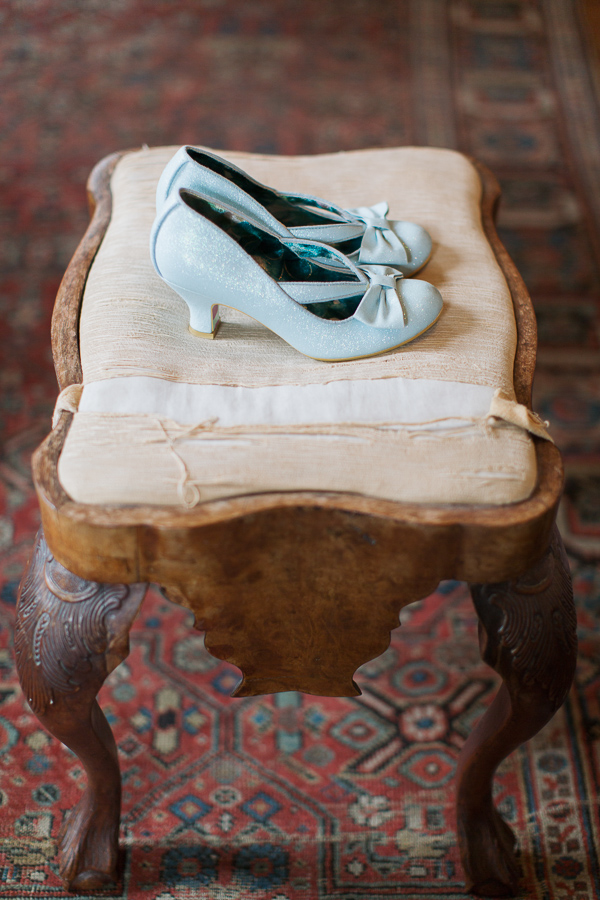 blue weddign shoes on a vintage stool