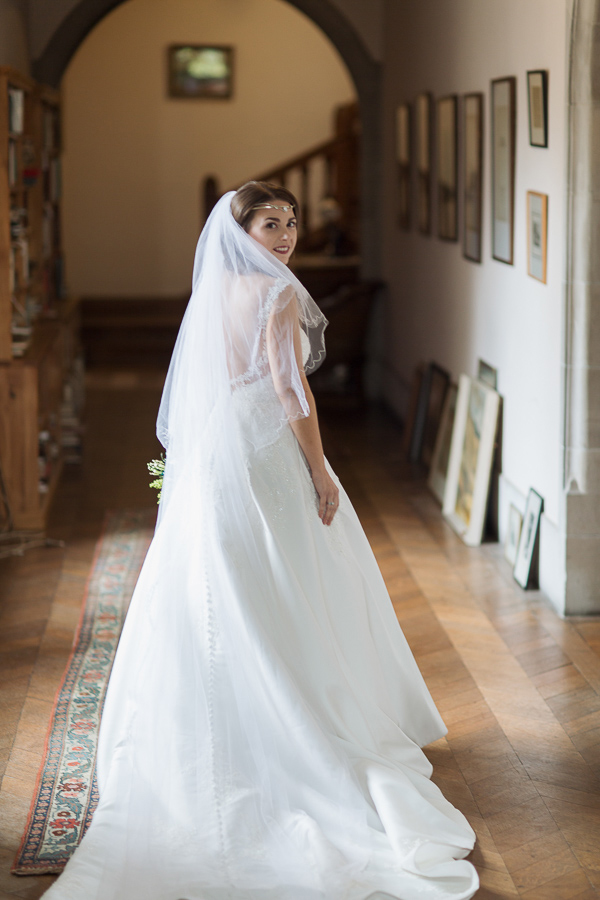 bride waling down corridor at ardkinglas wedding venue