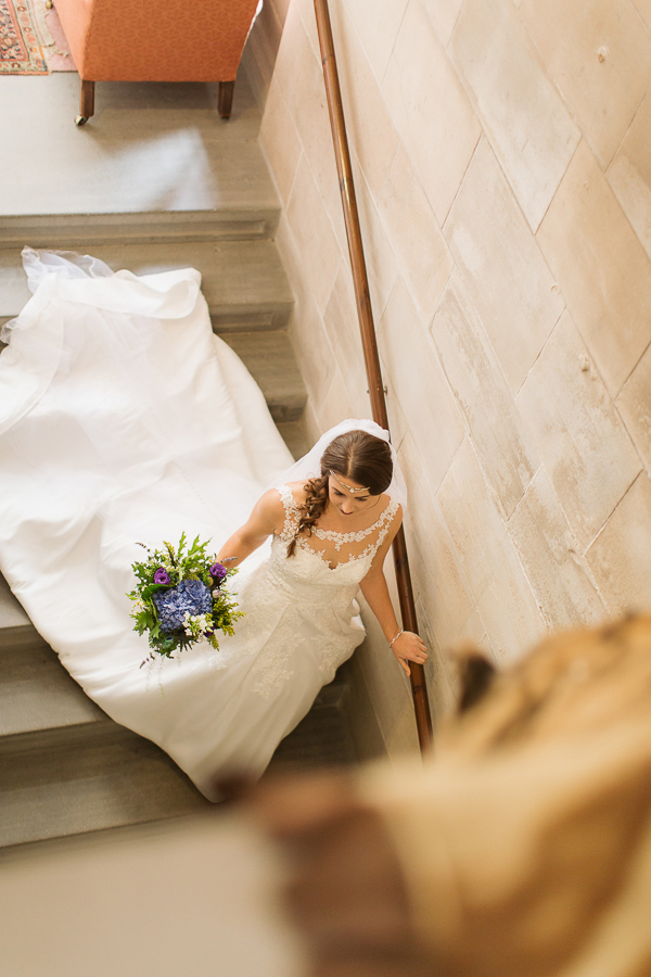 bride walking down the stairs leaving for ceremony