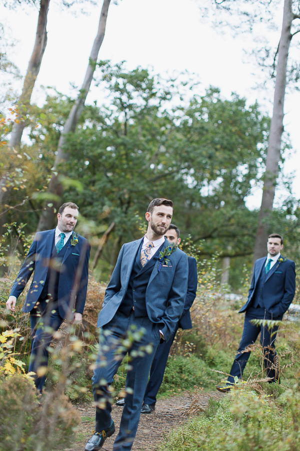 groom with groomsmen walking down to ceremony