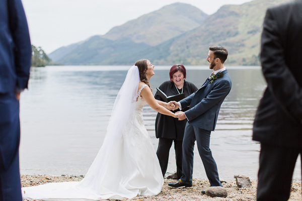 bride and groom holding hands during weddign ceremony