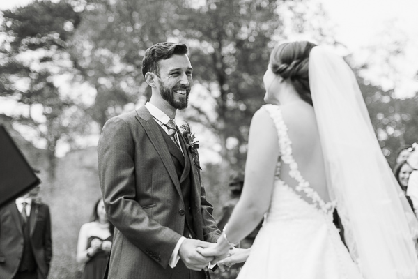 groom looking at bride with love 