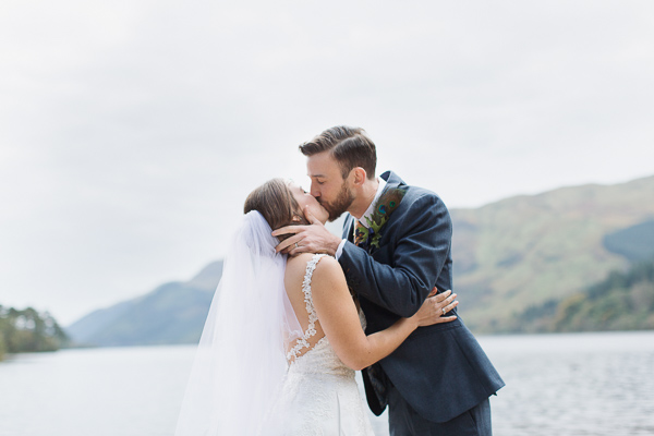 bride and groom kissing during ceremony scotland