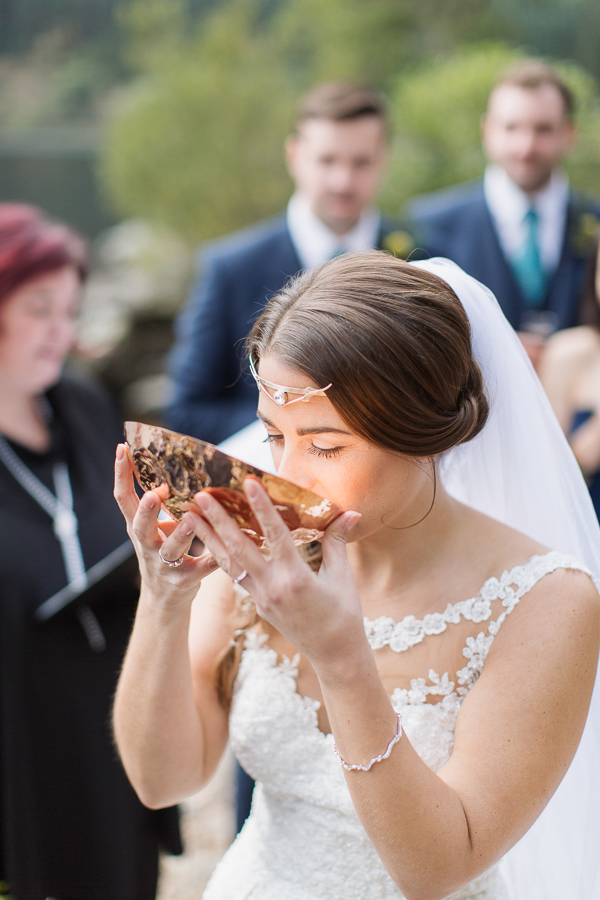 bride drinking from quechee wedding ceremony