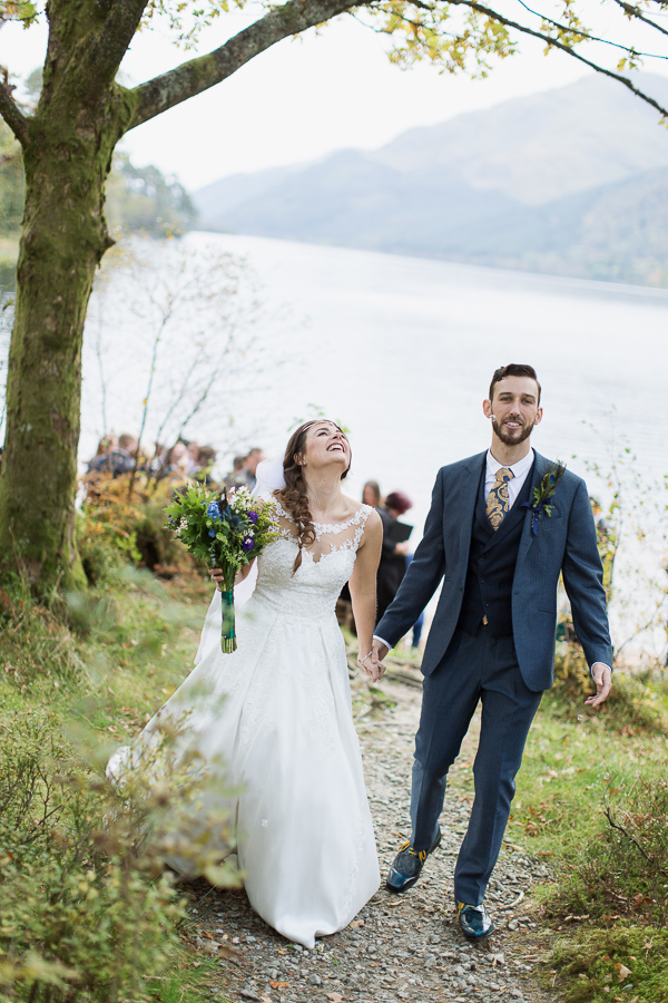 bride and groom just married walking