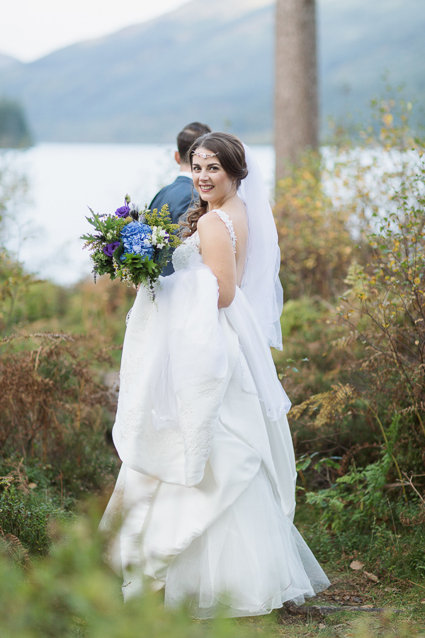 groom is pulling bride away from wedding photographer glasgow
