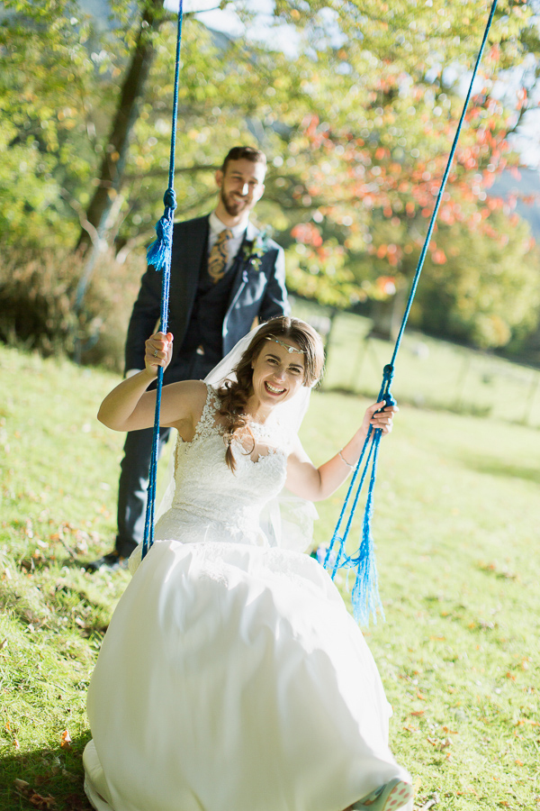 weddign photographer glasgow bride laughing on a swing 