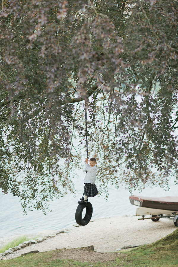 boy on a tire swing