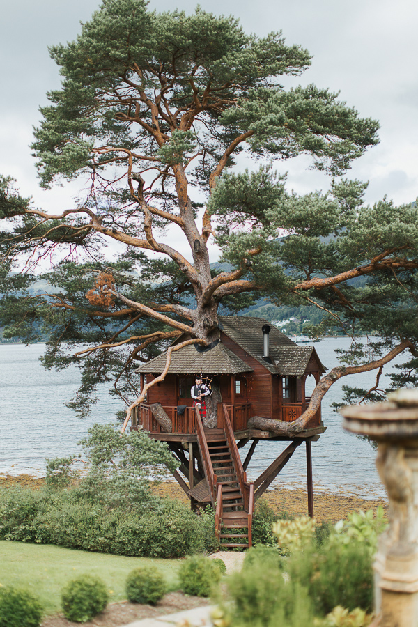 tree house at the lodge on loch goil scottish wedding venue with piper