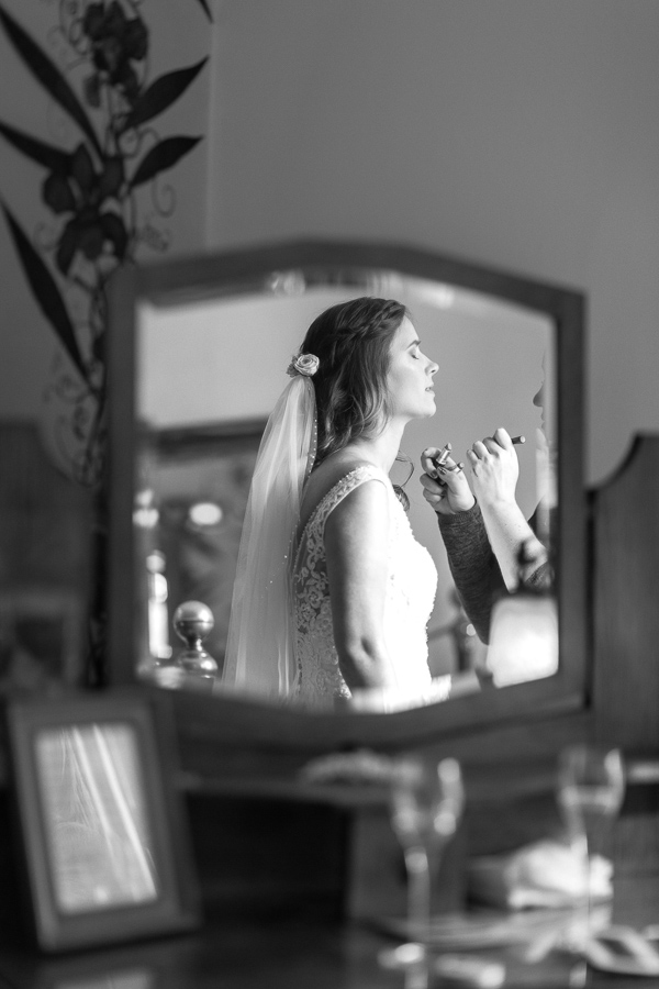 bride having her makeup done final touches