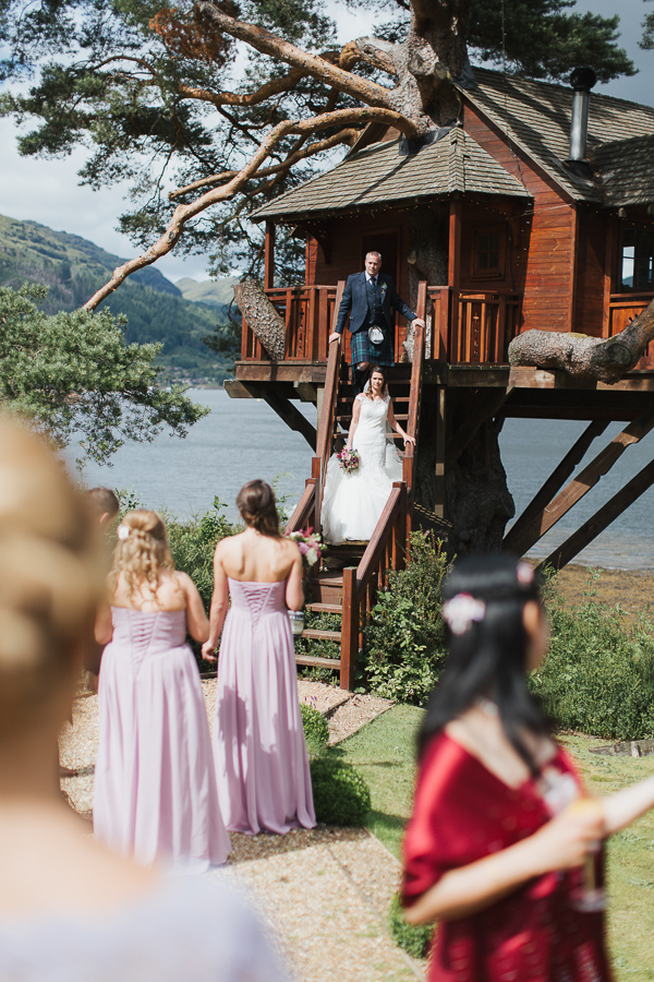 bride and groom at tree house over loch goil