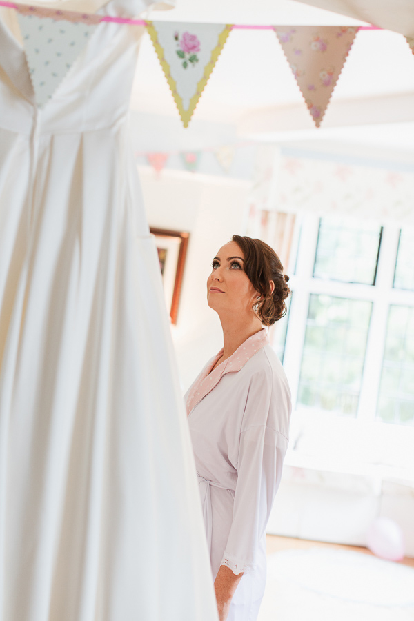 bride looking at her wedding dress bearsden glasgow