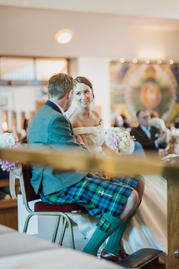 bride and groom looking at each other during ceremony