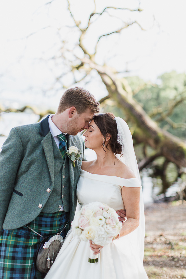 bride and groom clser together