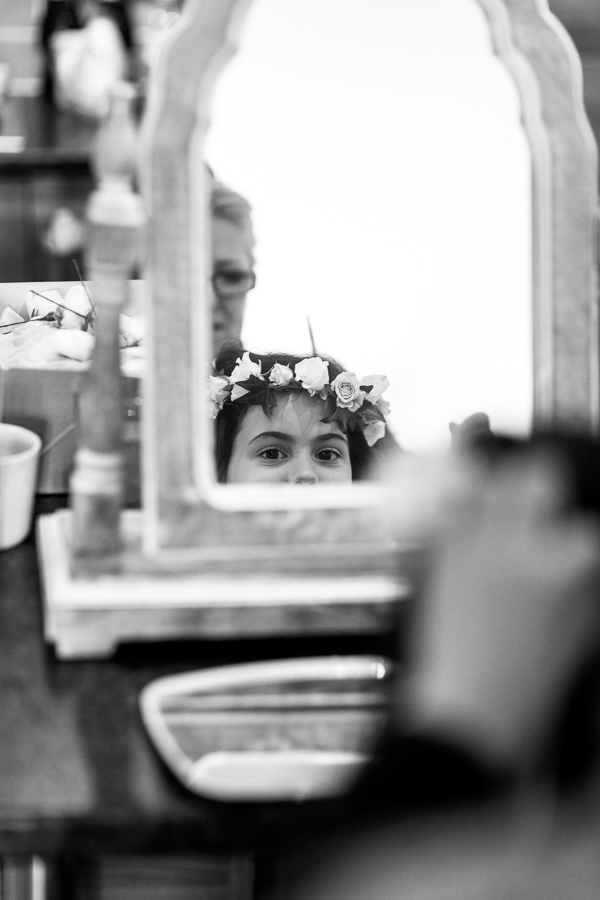 flower gril getting ready for a wedding in mar hall