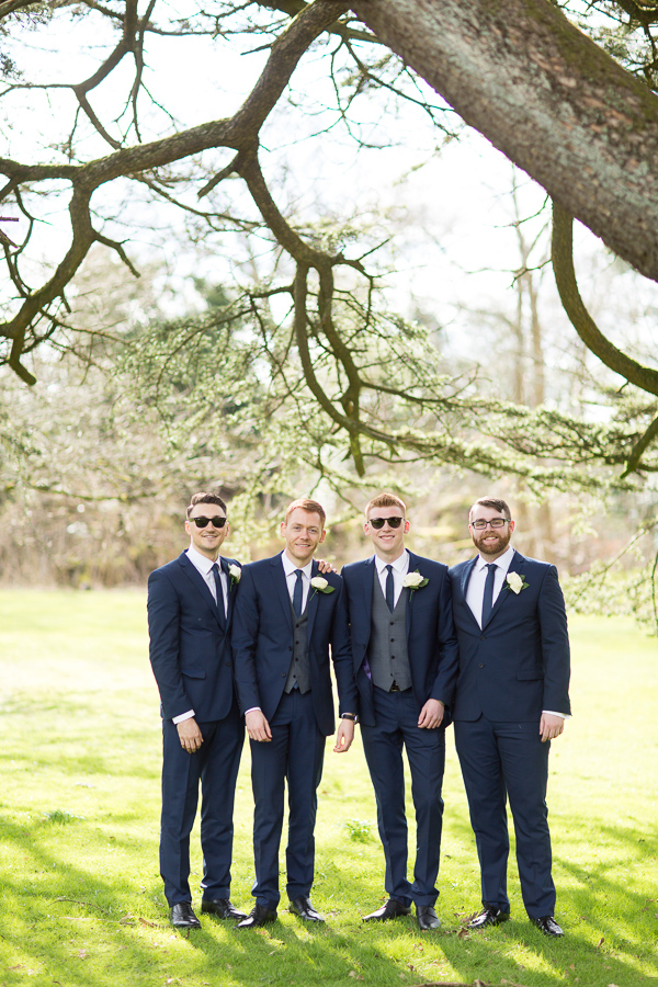 groom with his ushers posing for photos at the wedding in mar hall
